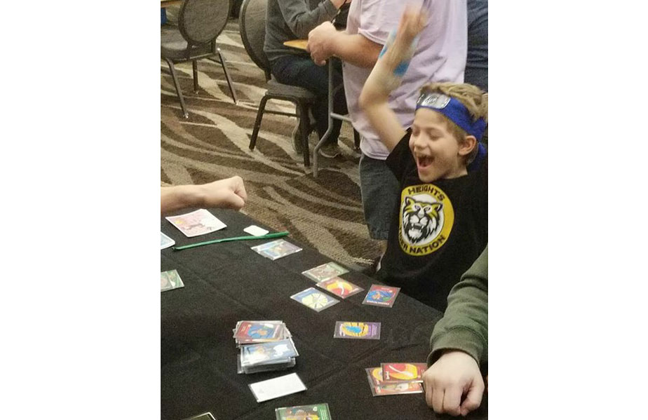 Demo player Rice celebrating the moment when he beat his father, Chad, and Ray in Oh ClucK! 